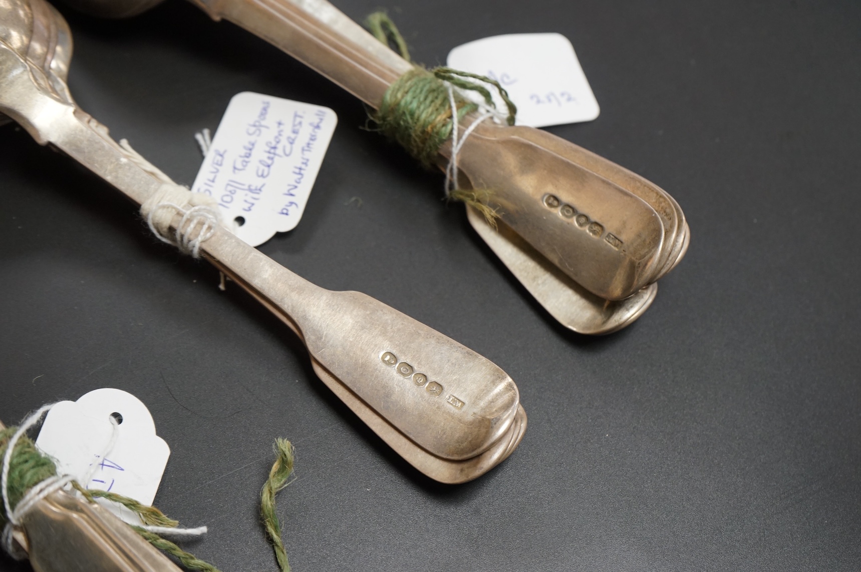 A set of ten George IV silver fiddle pattern table spoons and five dessert spoons by William M. Traies, London, 1829 and one other matched silver dessert spoon, 32.7oz.